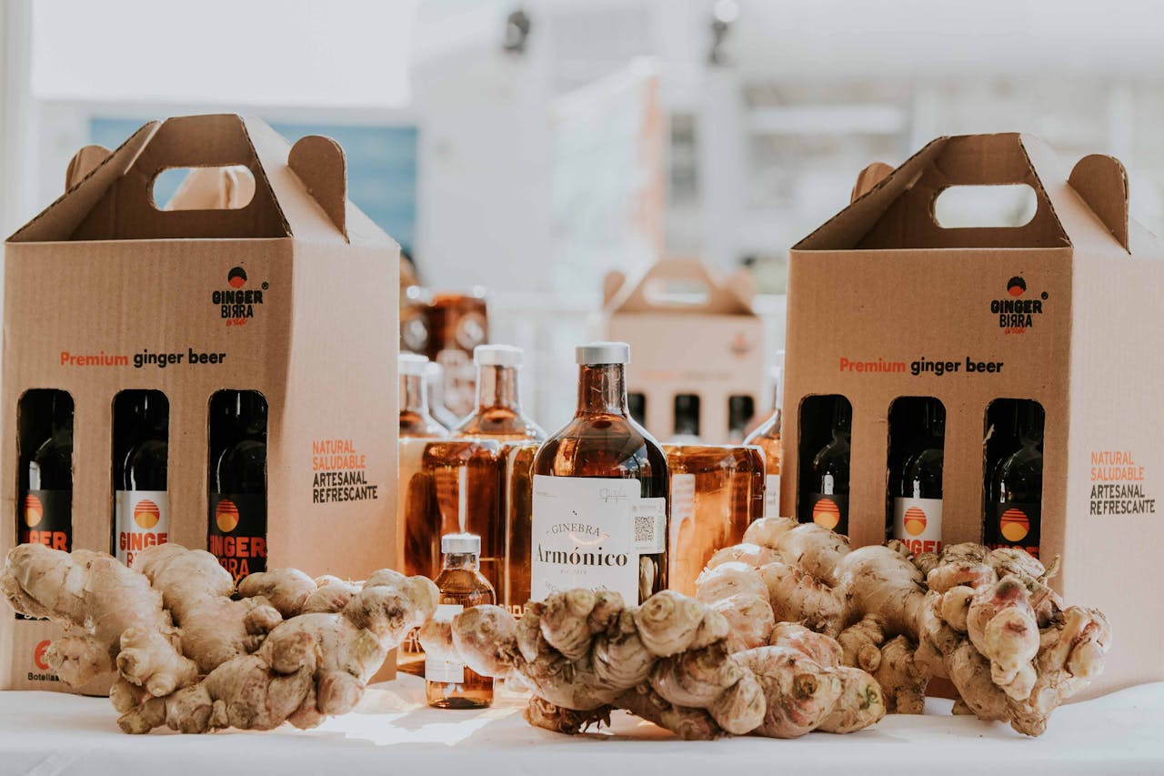 collection-03 Showcasing premium ginger beer bottles accompanied by fresh ginger roots on a display table.
